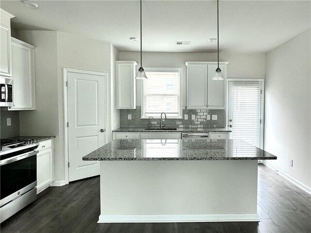 3658 Hidden Valley Cir, Lawrenceville, GA 30044 - kitchen with a sink, decorative backsplash, white cabinetry, appliances with stainless steel finishes, and dark wood-style floors