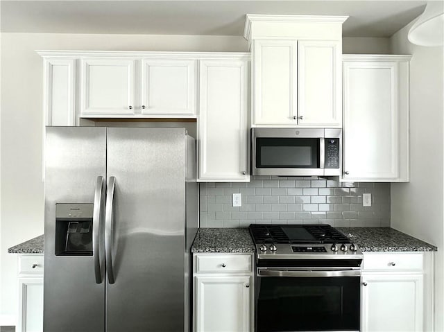 3658 Hidden Valley Cir, Lawrenceville, GA 30044 - kitchen featuring white cabinets, appliances with stainless steel finishes, and decorative backsplash