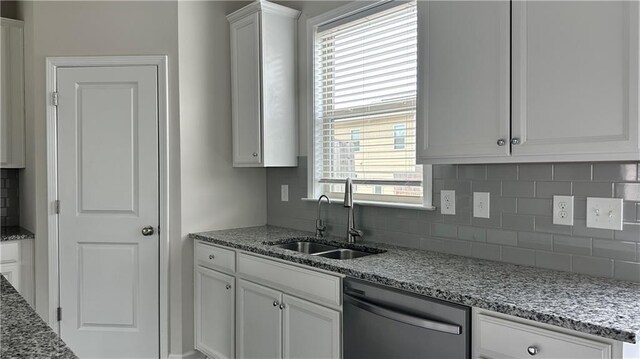 3658 Hidden Valley Cir, Lawrenceville, GA 30044 - kitchen with tasteful backsplash, dishwasher, light stone countertops, and a sink