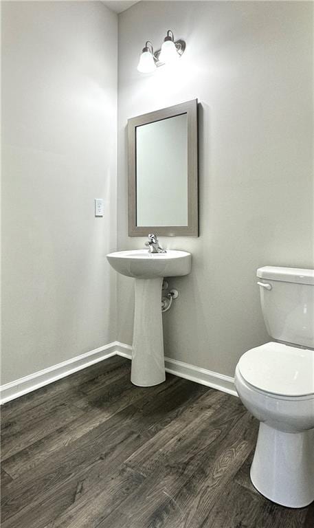 3658 Hidden Valley Cir, Lawrenceville, GA 30044 - bathroom with wood finished floors, toilet, and baseboards