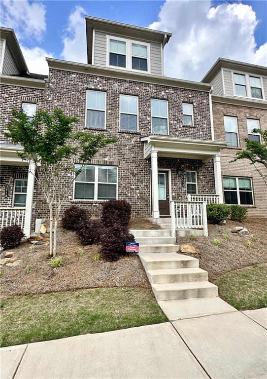 3658 Hidden Valley Cir, Lawrenceville, GA 30044 - view of front of property featuring brick siding and covered porch