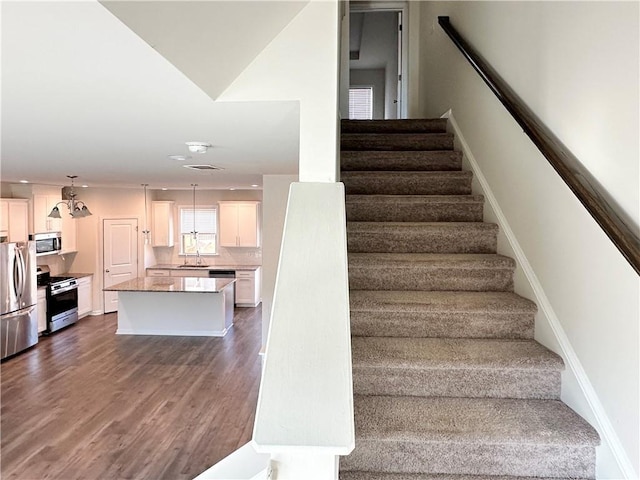 3658 Hidden Valley Cir, Lawrenceville, GA 30044 - stairs with baseboards and wood finished floors
