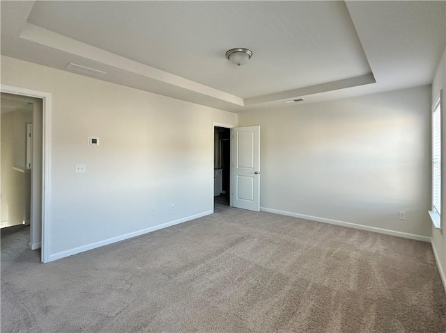 3658 Hidden Valley Cir, Lawrenceville, GA 30044 - carpeted spare room with baseboards and a tray ceiling
