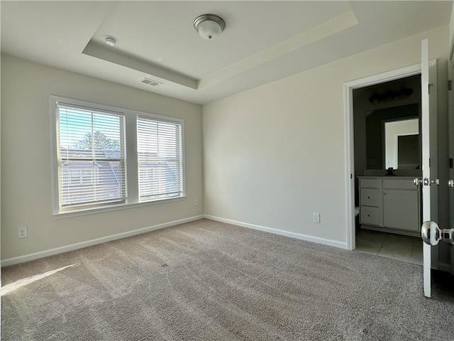 3658 Hidden Valley Cir, Lawrenceville, GA 30044 - empty room with a raised ceiling, visible vents, baseboards, and light carpet