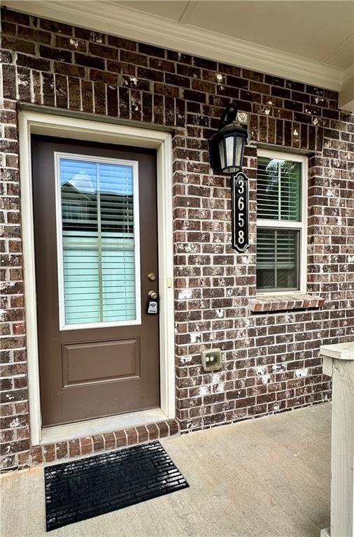 3658 Hidden Valley Cir, Lawrenceville, GA 30044 - view of exterior entry featuring brick siding