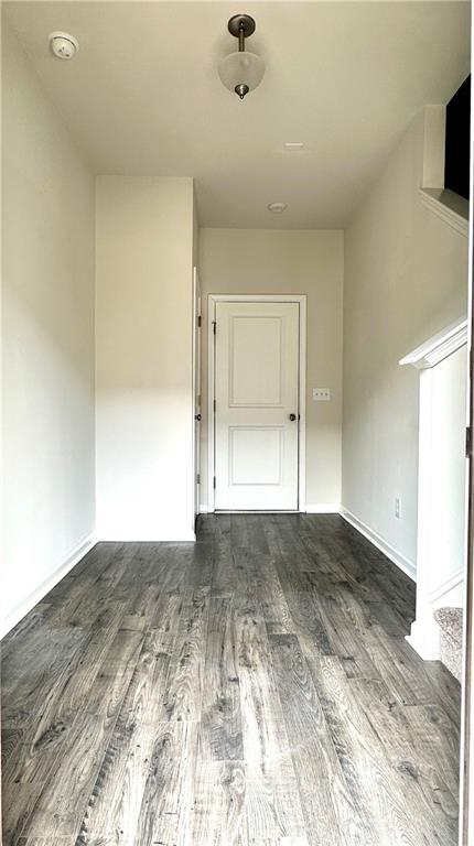 3658 Hidden Valley Cir, Lawrenceville, GA 30044 - spare room with baseboards and wood finished floors