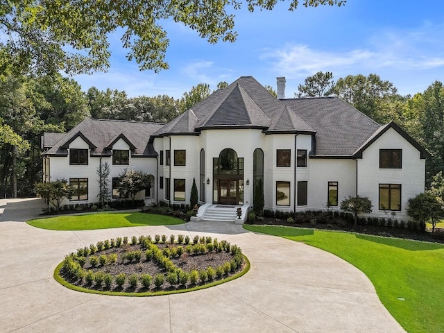 330 Longvue Ct, Johns Creek, GA 30097 - french country inspired facade with curved driveway, a front lawn, a chimney, and stucco siding