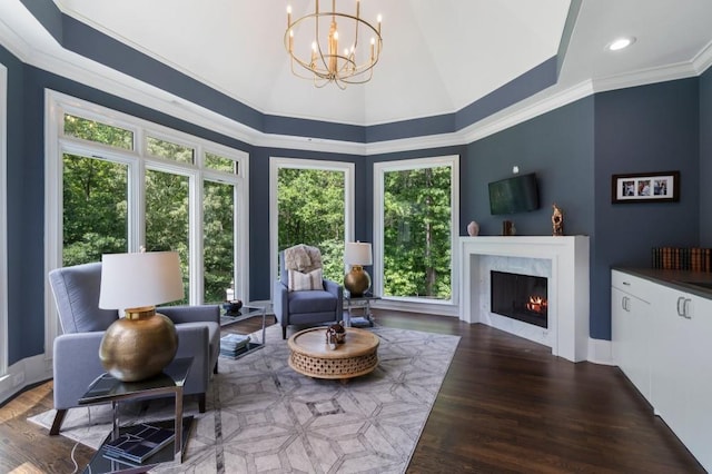 330 Longvue Ct, Johns Creek, GA 30097 - living room featuring a chandelier, a premium fireplace, wood finished floors, and ornamental molding