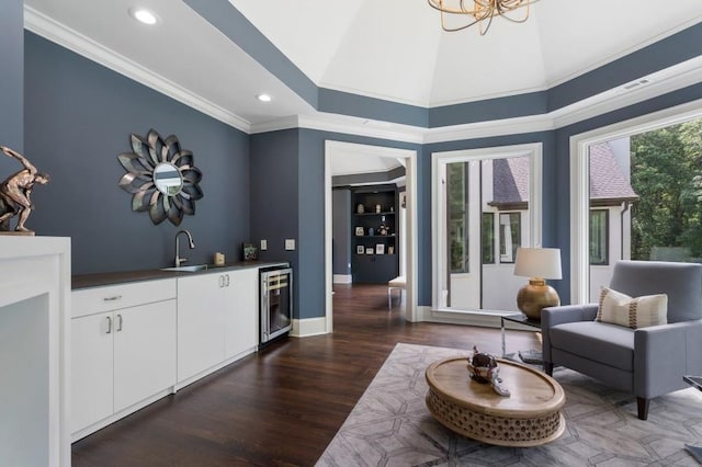 330 Longvue Ct, Johns Creek, GA 30097 - sitting room featuring wine cooler, bar with sink, wood finished floors, crown molding, and recessed lighting