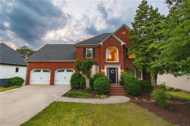 4222 Honey Creek Way, Powder Springs, GA 30127 - colonial home with driveway, a shingled roof, a front yard, an attached garage, and brick siding