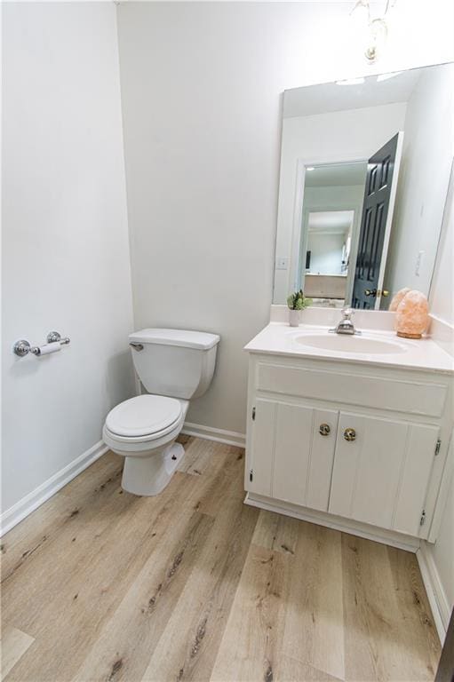 4222 Honey Creek Way, Powder Springs, GA 30127 - half bath with toilet, vanity, wood finished floors, and baseboards