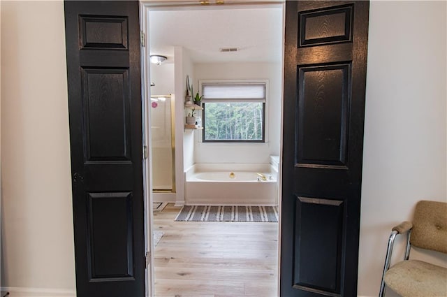 4222 Honey Creek Way, Powder Springs, GA 30127 - full bathroom with a bath, visible vents, a shower stall, and wood finished floors