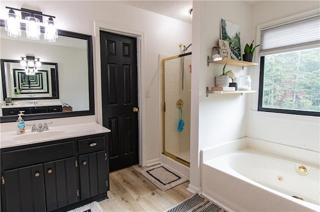 4222 Honey Creek Way, Powder Springs, GA 30127 - full bathroom with a shower stall, a chandelier, a bath, a healthy amount of sunlight, and wood finished floors
