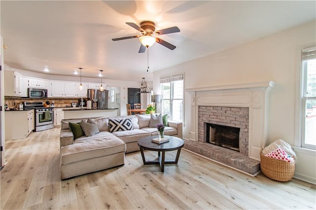 4222 Honey Creek Way, Powder Springs, GA 30127 - living room with light wood-style flooring, a healthy amount of sunlight, and ceiling fan