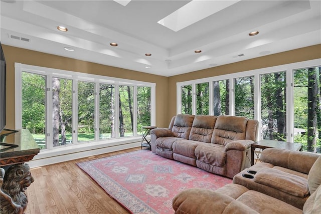 1819 Yorkshire Dr, Woodstock, GA 30189 - living area with visible vents, recessed lighting, a skylight, wood finished floors, and a raised ceiling