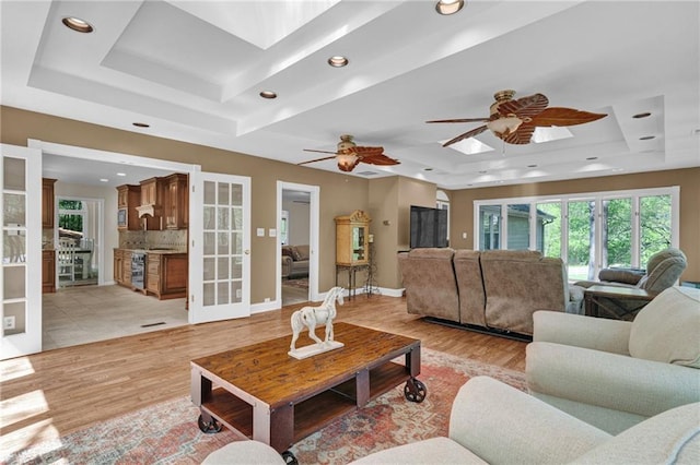 1819 Yorkshire Dr, Woodstock, GA 30189 - living room with recessed lighting, light wood-style flooring, french doors, and a raised ceiling