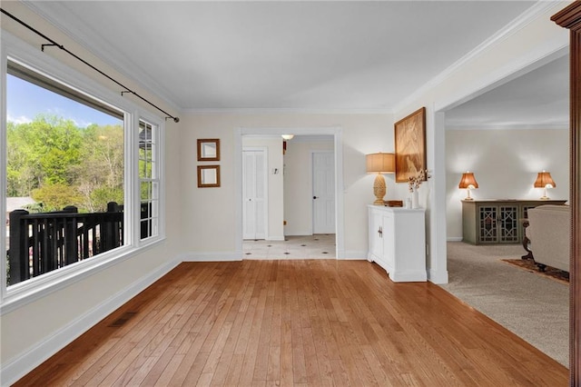1819 Yorkshire Dr, Woodstock, GA 30189 - spare room with light wood finished floors, visible vents, baseboards, and ornamental molding