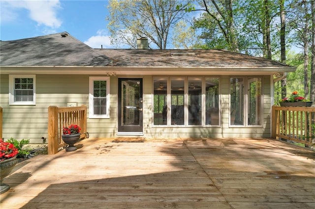 1819 Yorkshire Dr, Woodstock, GA 30189 - rear view of house with roof with shingles, a wooden deck, and a chimney