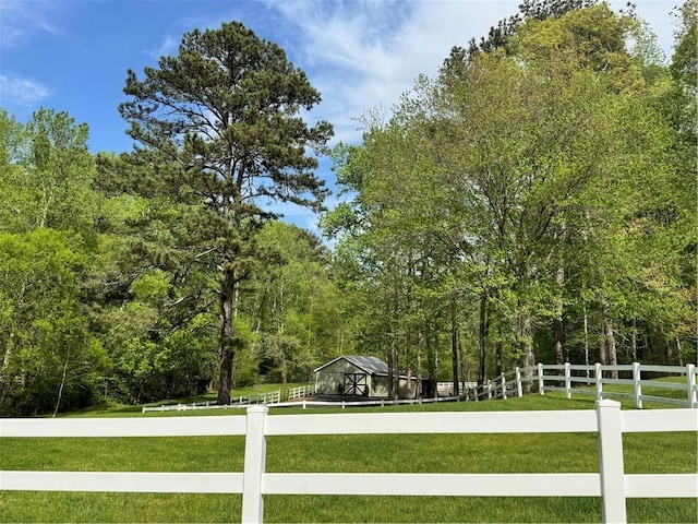 1819 Yorkshire Dr, Woodstock, GA 30189 - exterior space with an outbuilding, fence, and a wooded view