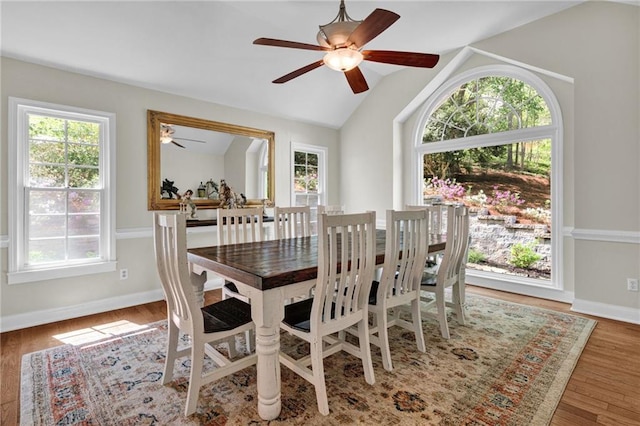 1819 Yorkshire Dr, Woodstock, GA 30189 - dining area featuring wood finished floors, baseboards, a ceiling fan, and lofted ceiling