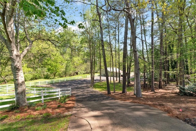1819 Yorkshire Dr, Woodstock, GA 30189 - view of home's community featuring a wooded view and fence