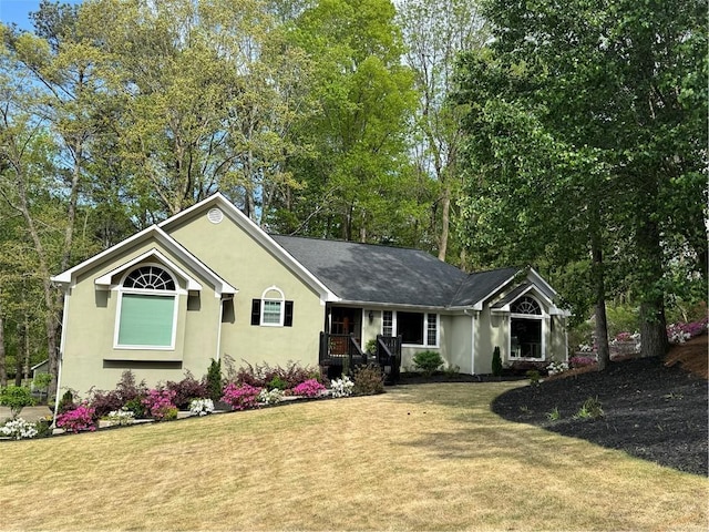1819 Yorkshire Dr, Woodstock, GA 30189 - ranch-style house with a shingled roof, stucco siding, and a front lawn