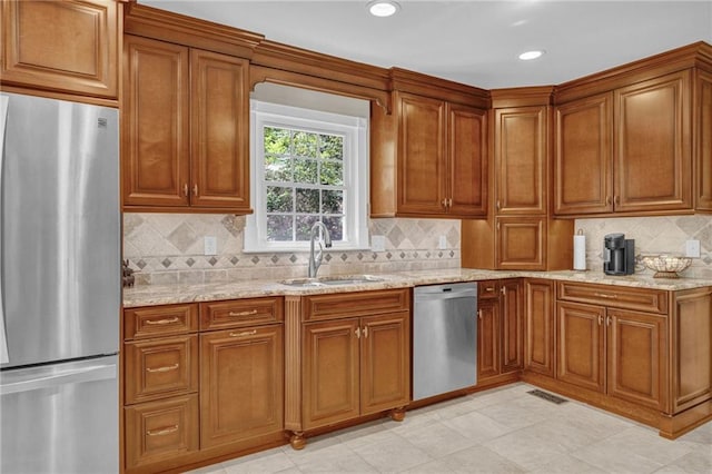 1819 Yorkshire Dr, Woodstock, GA 30189 - kitchen featuring brown cabinets, a sink, light stone countertops, and stainless steel appliances