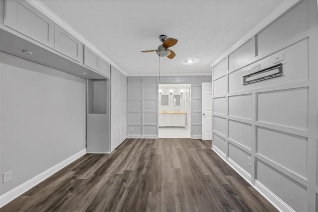 interior space with ceiling fan