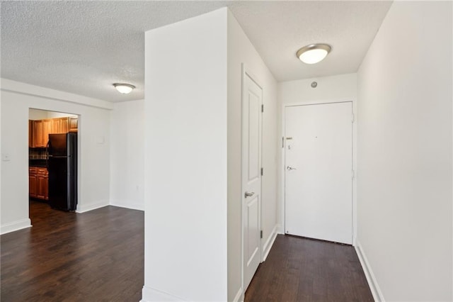 2479 Peachtree Rd NE Unit 1703, Atlanta, GA 30305 - hallway featuring dark wood-type flooring and a textured ceiling