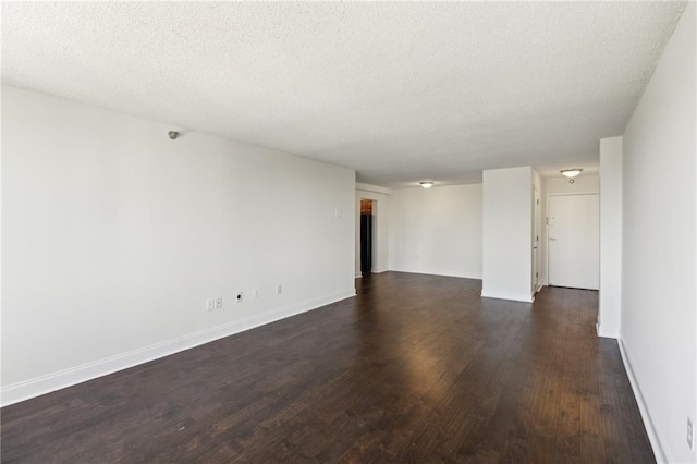 2479 Peachtree Rd NE Unit 1703, Atlanta, GA 30305 - unfurnished room featuring dark wood-style floors and a textured ceiling