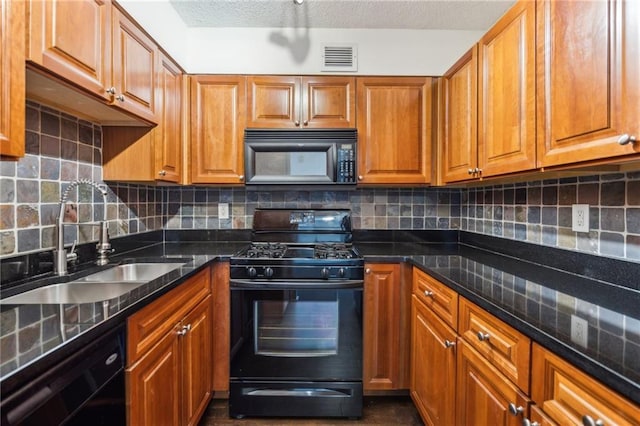 2479 Peachtree Rd NE Unit 1703, Atlanta, GA 30305 - kitchen featuring black appliances, brown cabinets, and backsplash