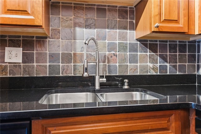 2479 Peachtree Rd NE Unit 1703, Atlanta, GA 30305 - kitchen featuring backsplash, dark countertops, and brown cabinets