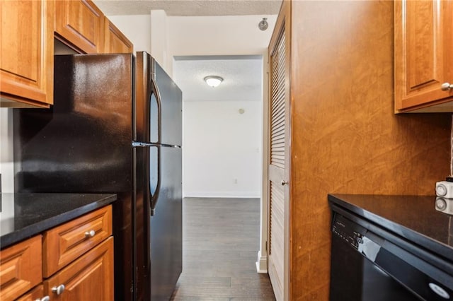 2479 Peachtree Rd NE Unit 1703, Atlanta, GA 30305 - kitchen with black appliances, a textured ceiling, dark wood-style floors, and brown cabinets