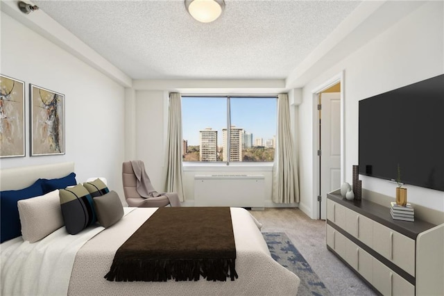 2479 Peachtree Rd NE Unit 1703, Atlanta, GA 30305 - bedroom with a textured ceiling and light carpet