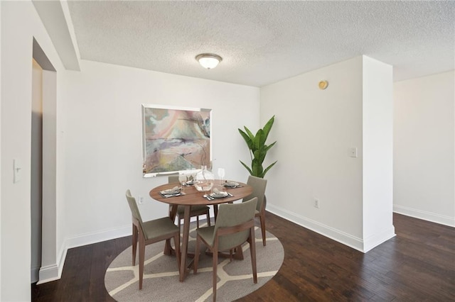 2479 Peachtree Rd NE Unit 1703, Atlanta, GA 30305 - dining room with wood finished floors and a textured ceiling