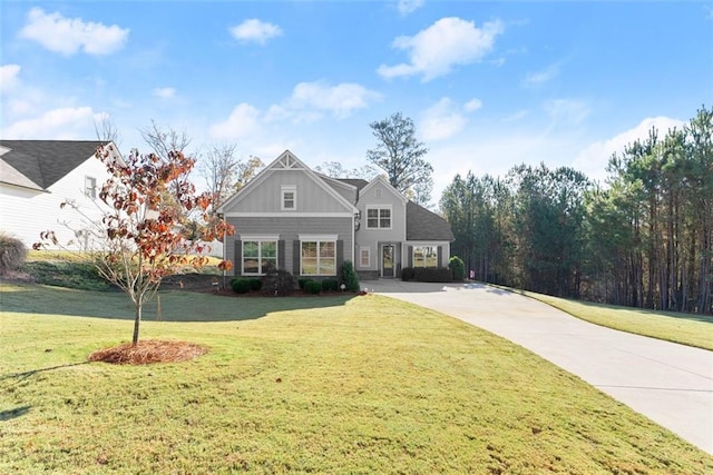 view of front of home with a front lawn and board and batten siding