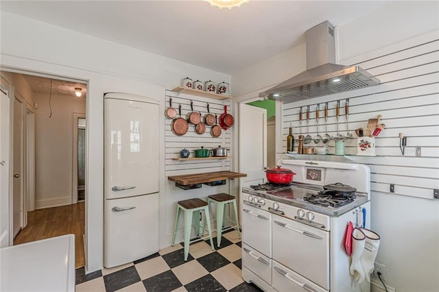 2669 Jefferson Ter, East Point, GA 30344 - kitchen featuring double oven range, extractor fan, and light floors