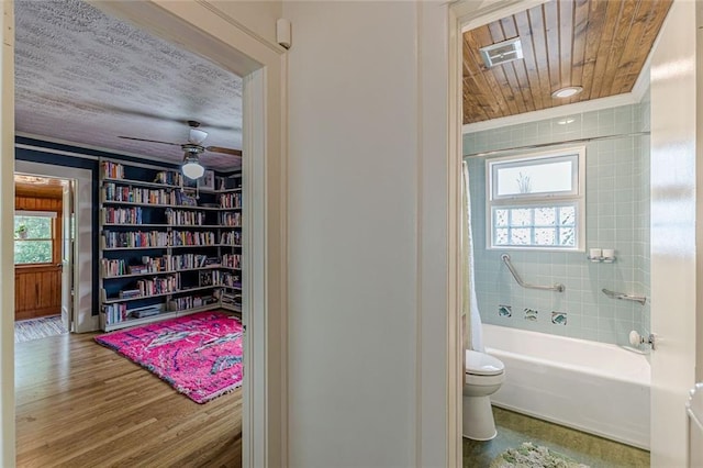 2669 Jefferson Ter, East Point, GA 30344 - full bath featuring toilet, healthy amount of natural light, shower / bath combo with shower curtain, and wood finished floors
