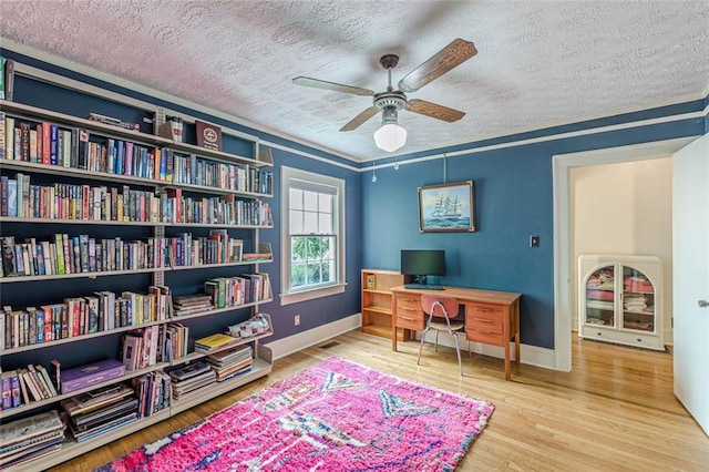 2669 Jefferson Ter, East Point, GA 30344 - office with a textured ceiling, ceiling fan, wood finished floors, baseboards, and crown molding
