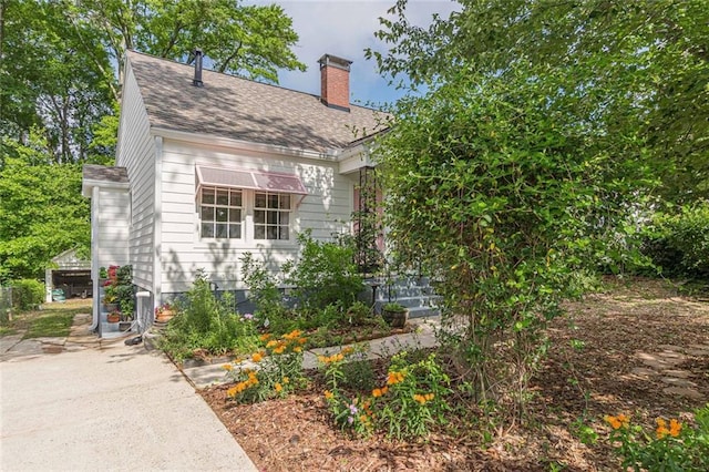 2669 Jefferson Ter, East Point, GA 30344 - view of front of house with a chimney and a shingled roof