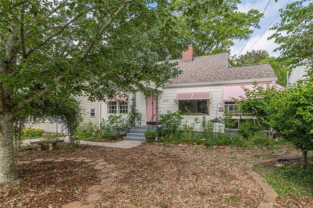 2669 Jefferson Ter, East Point, GA 30344 - view of front of home with a chimney and roof with shingles