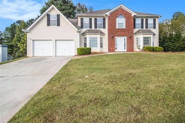 colonial-style house with a front yard and a garage