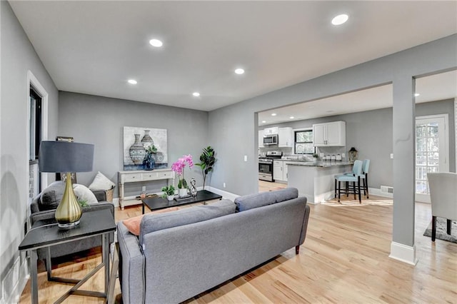 living room with light hardwood / wood-style flooring