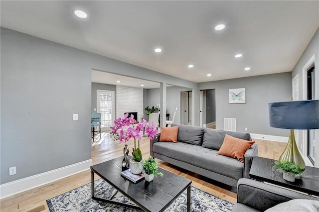 living room with light hardwood / wood-style floors