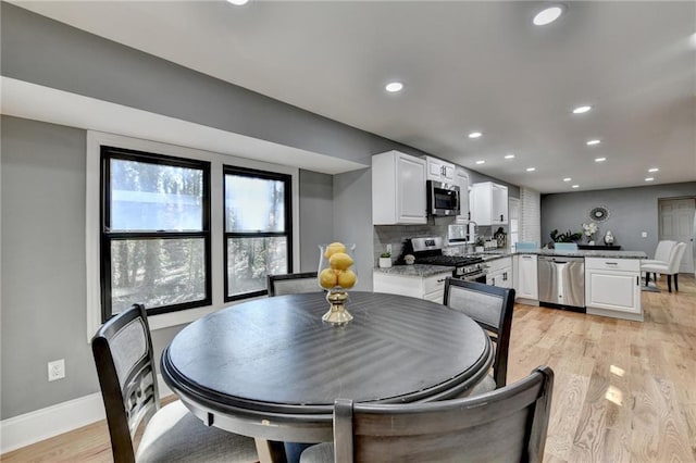 dining room featuring light hardwood / wood-style flooring