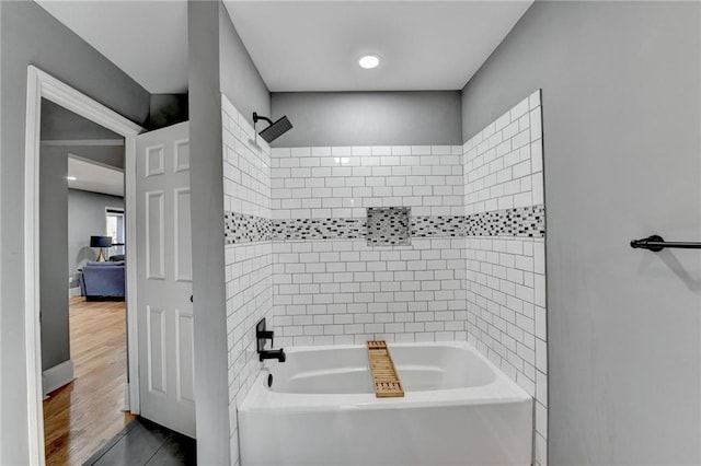 bathroom with tile patterned flooring and tiled shower / bath combo