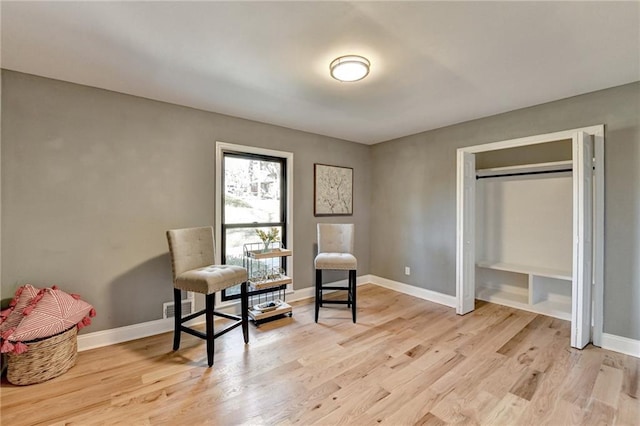 living area with light hardwood / wood-style floors