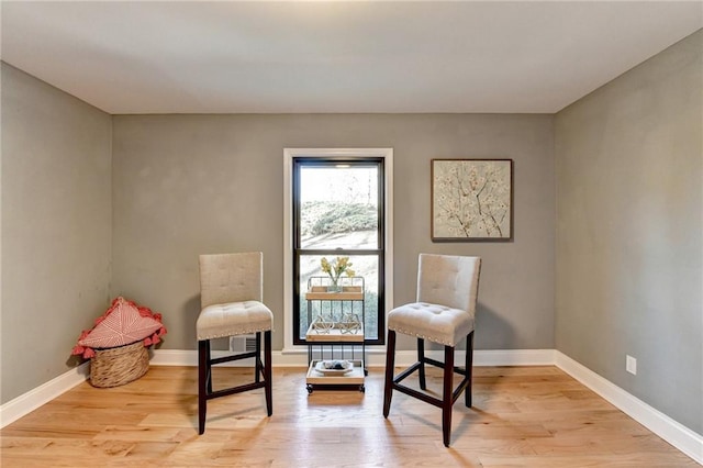 living area with light hardwood / wood-style floors