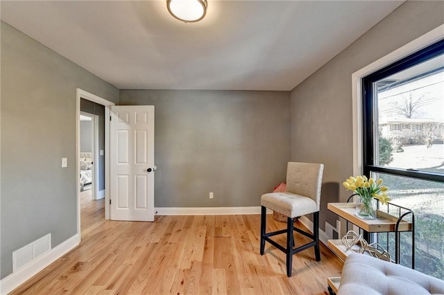 sitting room with light hardwood / wood-style flooring