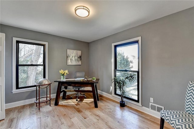 office area with light hardwood / wood-style flooring